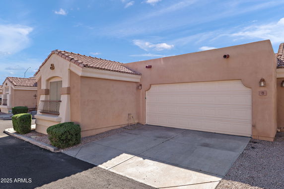 Front view of a single-story house with a two-car garage.