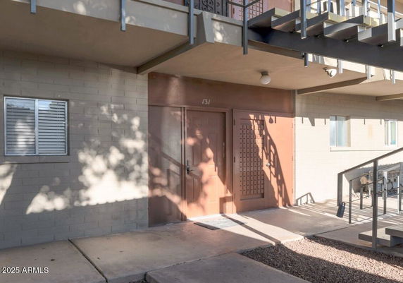 Front view of a building entryway with a covered entrance area.