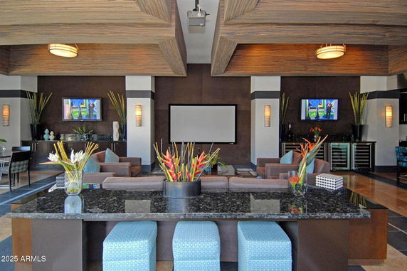 Interior of a modern clubhouse with lounge seating and decor.