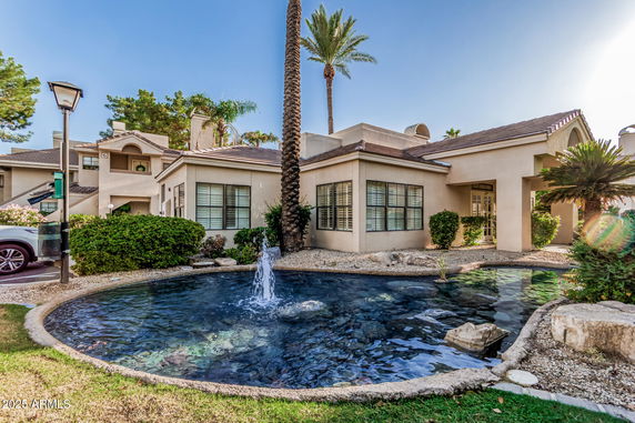 Front view of a multi-story house with a tiled roof.