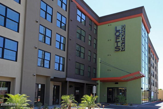 Front view of a modern multi-story apartment building.