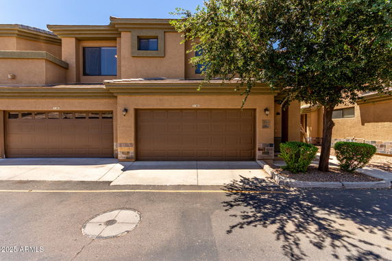 Front view of a two-story house with double garage.