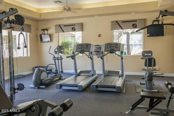 Indoor gym area with exercise equipment and treadmills.