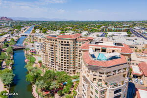 Panoramic view of high-rise buildings near a canal.