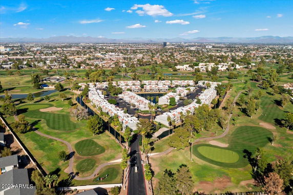 Panoramic view of a residential area surrounded by a golf course.