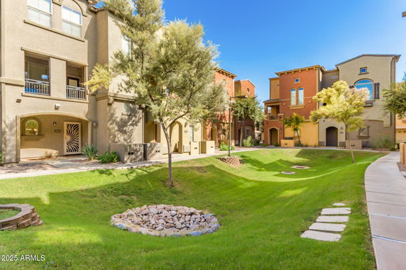 Front view of multiple multi-story residential buildings with balconies.