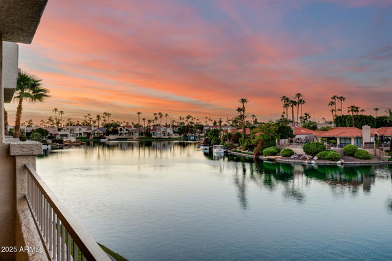 Panoramic view of a waterfront community at sunset.