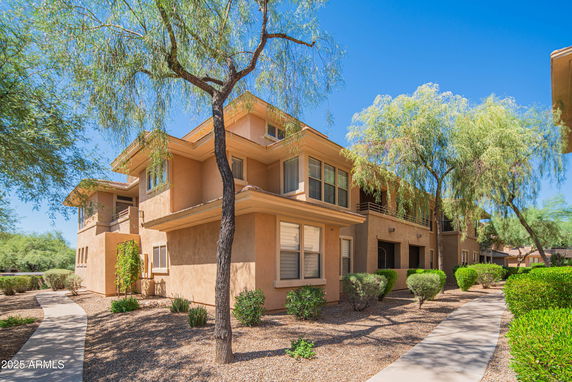 Front view of a two-story apartment building with a stucco exterior.