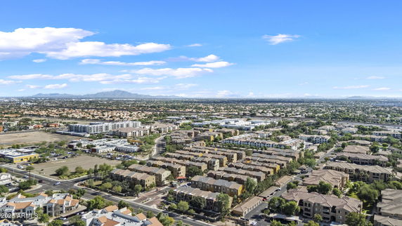 Panoramic view of a suburban area with residential buildings and roads.