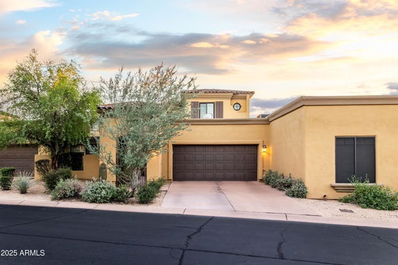 Front view of a two-story house with a double garage.