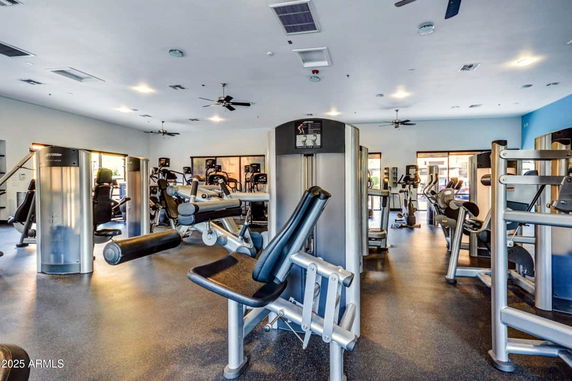 Interior view of a gym area with various exercise equipment.