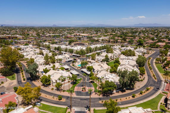 Panoramic view of a residential area with houses and streets.