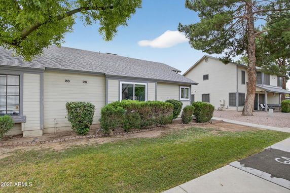 Front view of a single-story house with attached units 25 and 26.