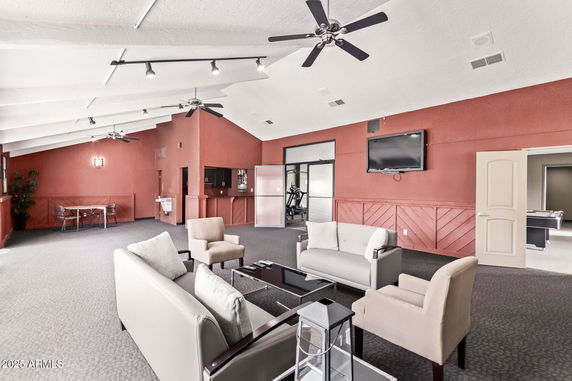 Spacious indoor recreation area with seating and exercise equipment.