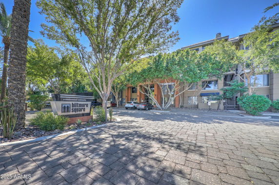 Front view of a condominium building with a sign reading 'Biltmore Square'.