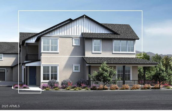 Front view of a two-story house with multiple windows and a small porch area.