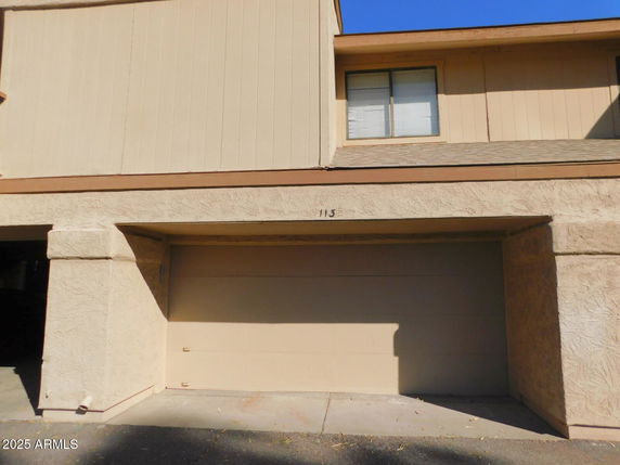 Front view of a house with an attached garage.