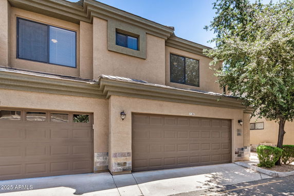 Front view of a two-story house with a double garage.