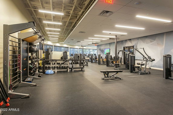 Interior view of a fitness area with various gym equipment.