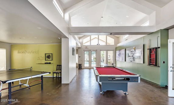 Indoor club house with a pool table and a table tennis setup.