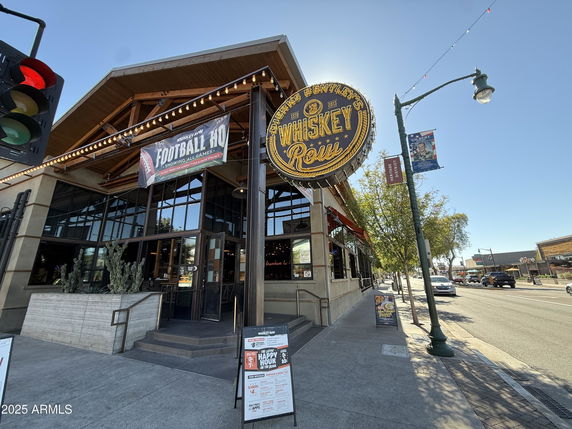 Front view of a building with large signage and entrance steps.