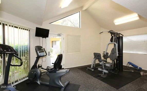 Interior view of a room with gym equipment.