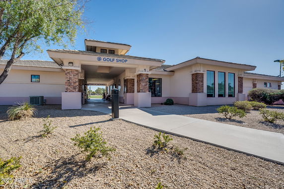 Front view of a one-story building labeled as a golf shop.