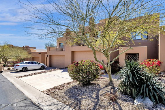 Front view of a modern two-story house with a double garage.