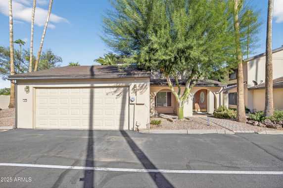 Front view of a single-story house with an attached double garage.
