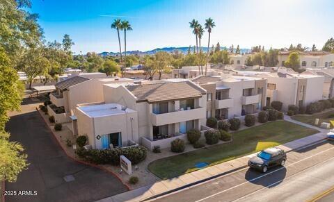 Aerial view of a modern apartment complex with multiple units and balconies.