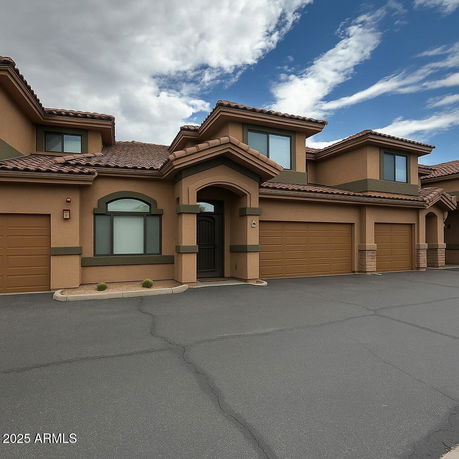 Front view of a two-story house with a double garage.