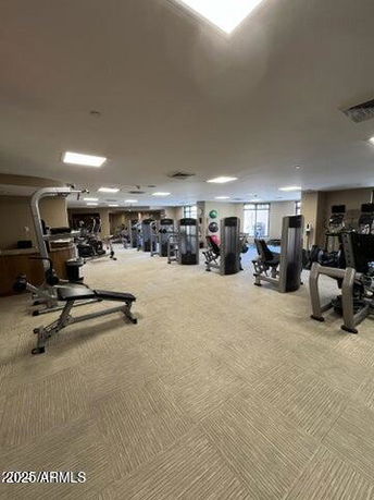 Interior view of a gym area with various fitness equipment.