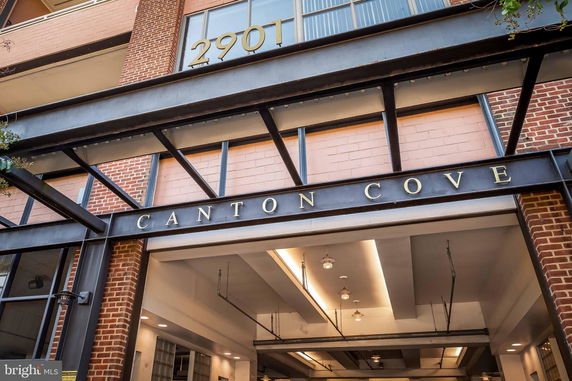 Front view of a building entrance with signage reading 'CANTON COVE'.