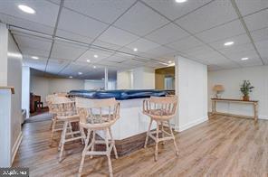 Recreational area with seating and a pool table.