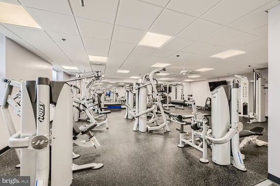 Interior view of a gym with various exercise equipment.