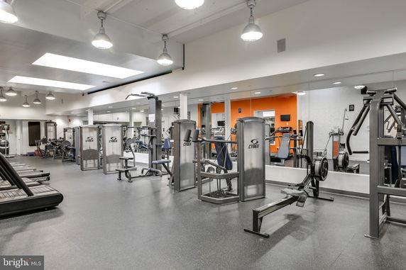 Indoor gym area with exercise machines and equipment