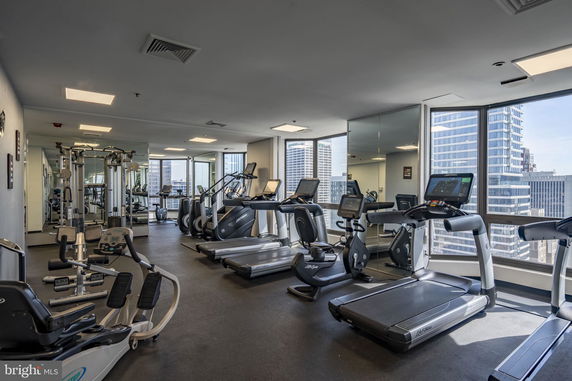 Interior view of a gym with fitness equipment in a building.