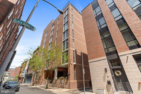 Front view of a multi-story brick building.