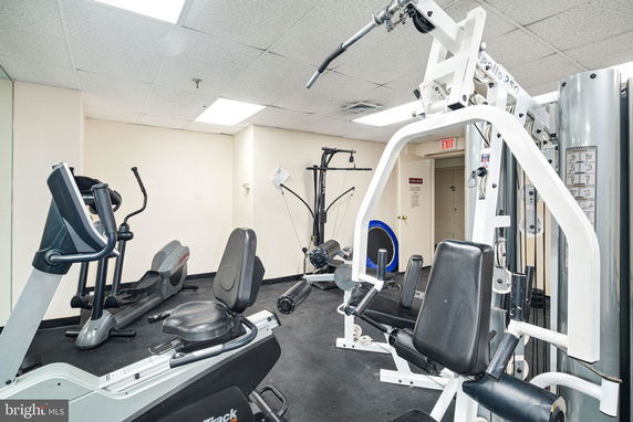 Indoor gym area with exercise equipment.