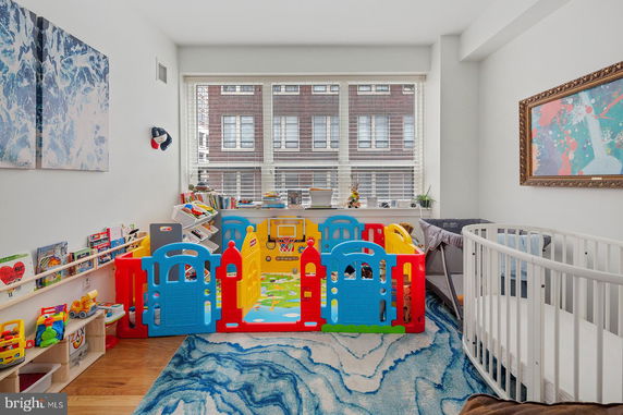 Room with a colorful indoor playpen and toys