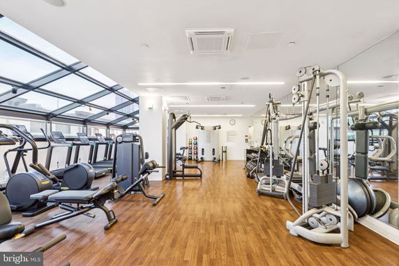 Interior view of a gym with various exercise equipment.