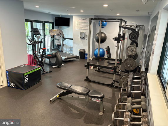 Indoor gym area with various exercise equipment.