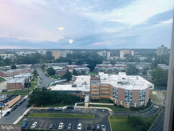 Panoramic view of a suburban area with multiple buildings and green spaces.