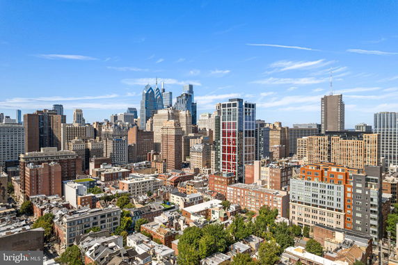 Panoramic view of a cityscape with various high-rise buildings and skyscrapers.
