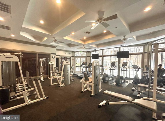 Interior view of a fitness gym with exercise equipment.