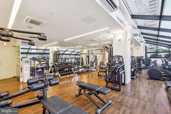 Interior view of a gym with various exercise equipment.