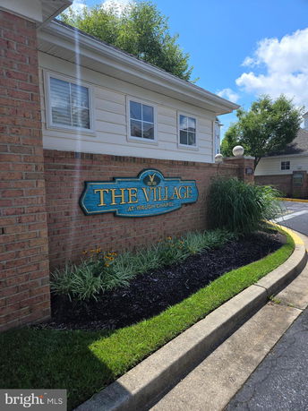 Front view of a building with signage reading 'The Village at Waugh Chapel'.