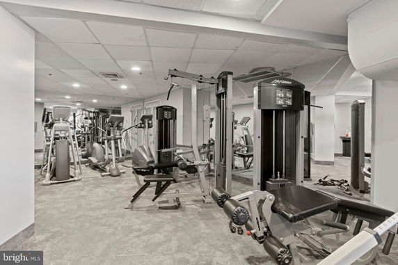 Interior view of a gym with various exercise equipment.