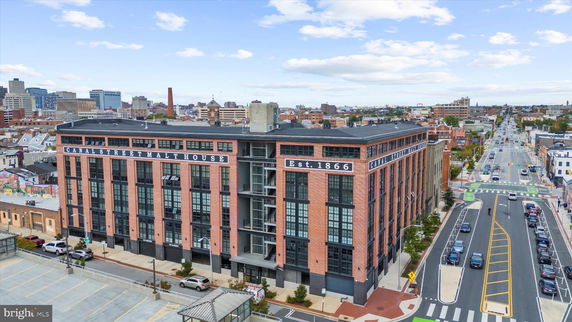 Front view of a historic brick building named Canal Street Malt House, established in 1866.