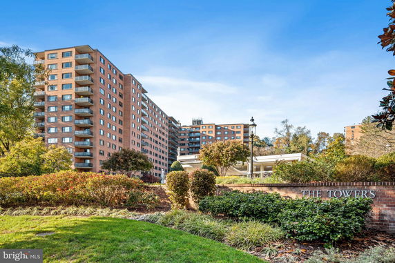 Front view of a multi-story apartment building labeled 'The Towers'.